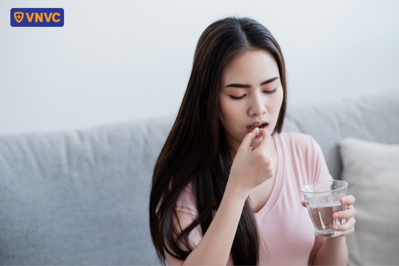 uống thuốc điều trị cúm